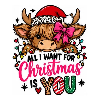 A highland calf in a Santa hat and pink bow peeking over All I Want for Christmas Is You.